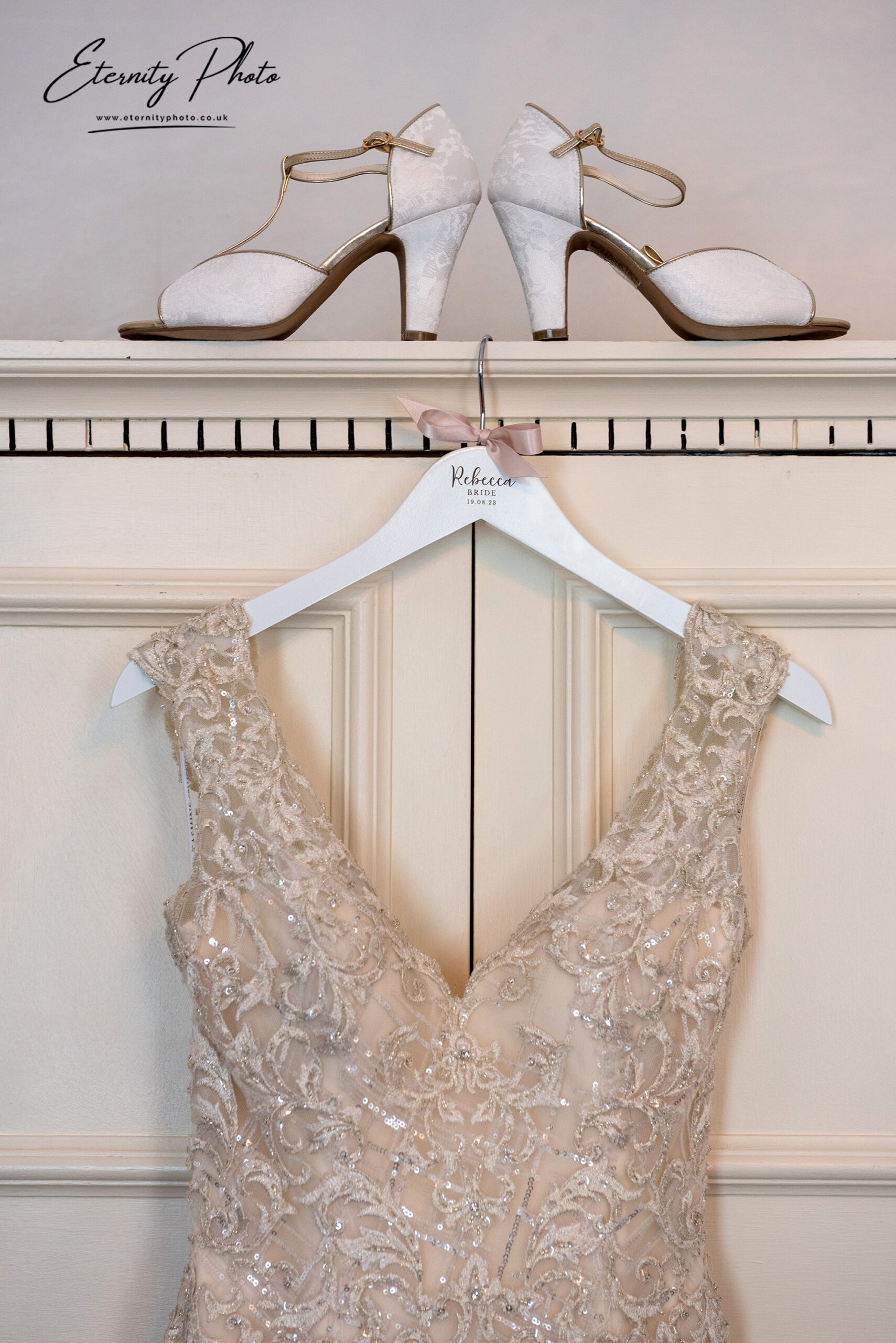 Elegant bridal shoes and wedding dress detail.