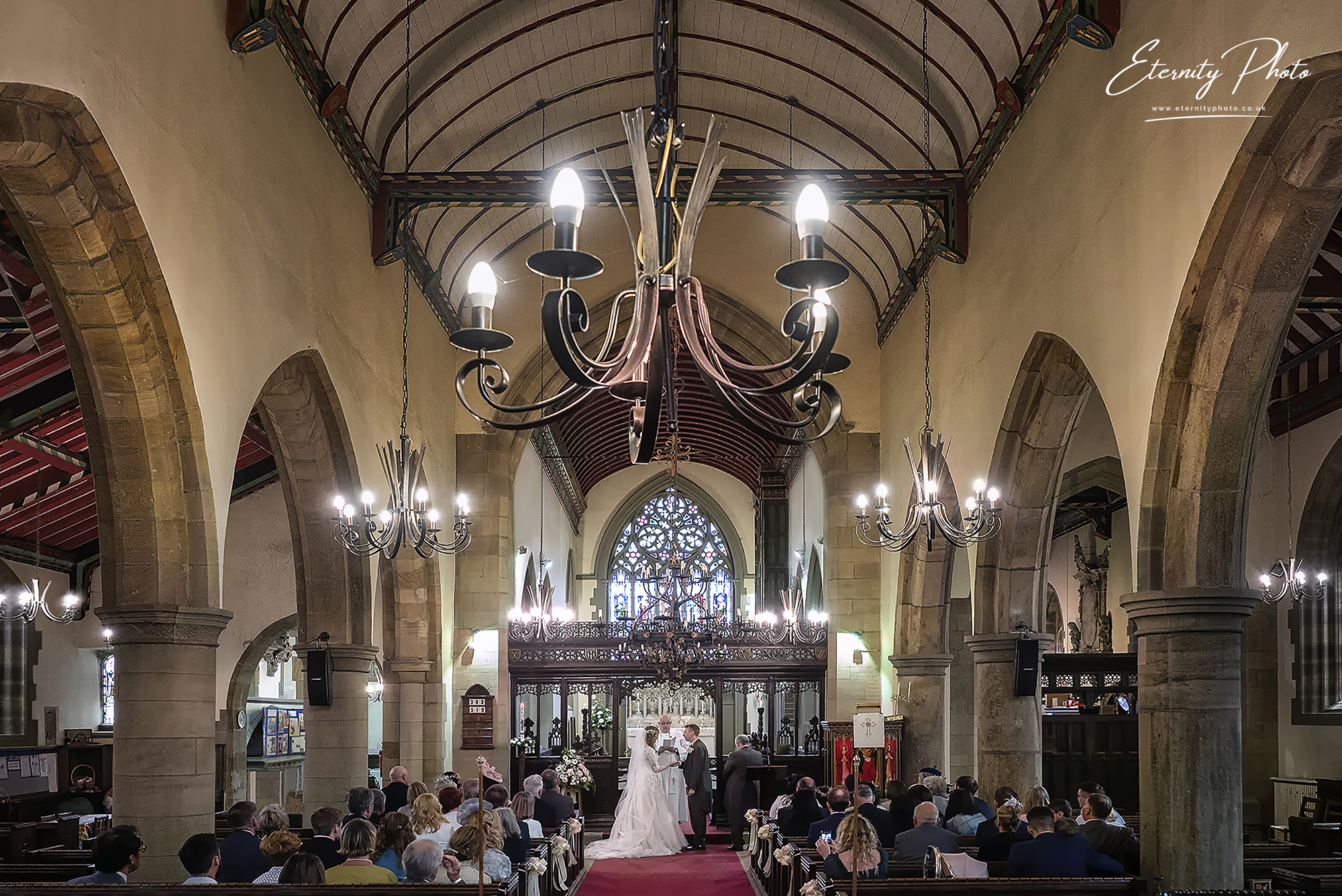 Wedding ceremony in traditional church interior.
